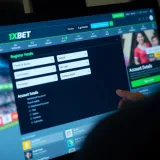 Screen showing 1xBet registration form with fields for personal details and account setup